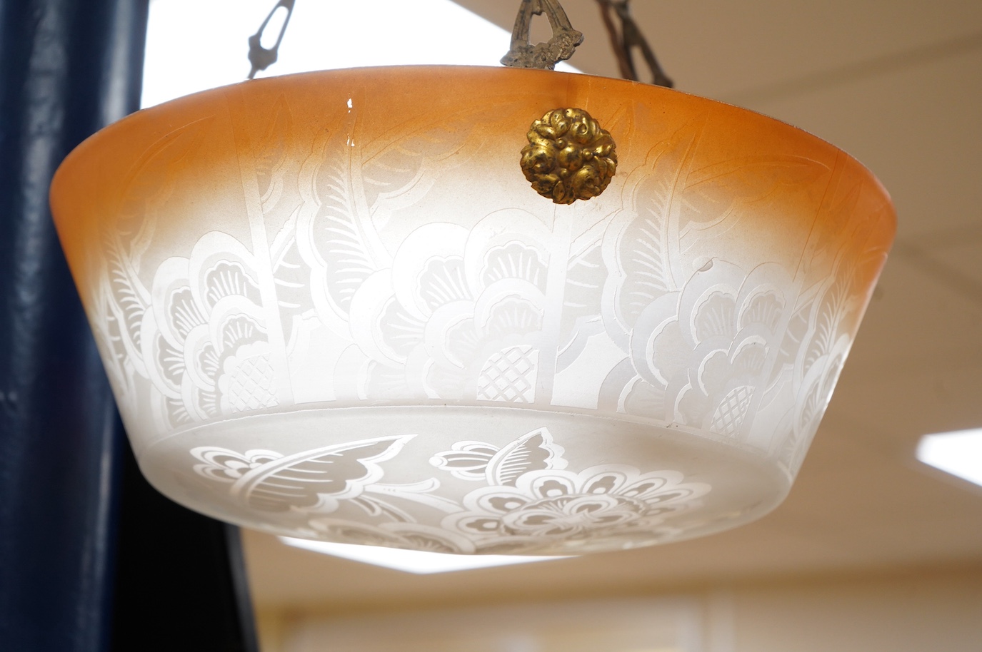 A French frosted glass acid etched with orange colour edge plaffonier ceiling light with original antique brass chain and ceiling rose, circa 1920’s-1930’s, wired, overall 47cm high, top of shade 35.5cm diameter, 13cm de